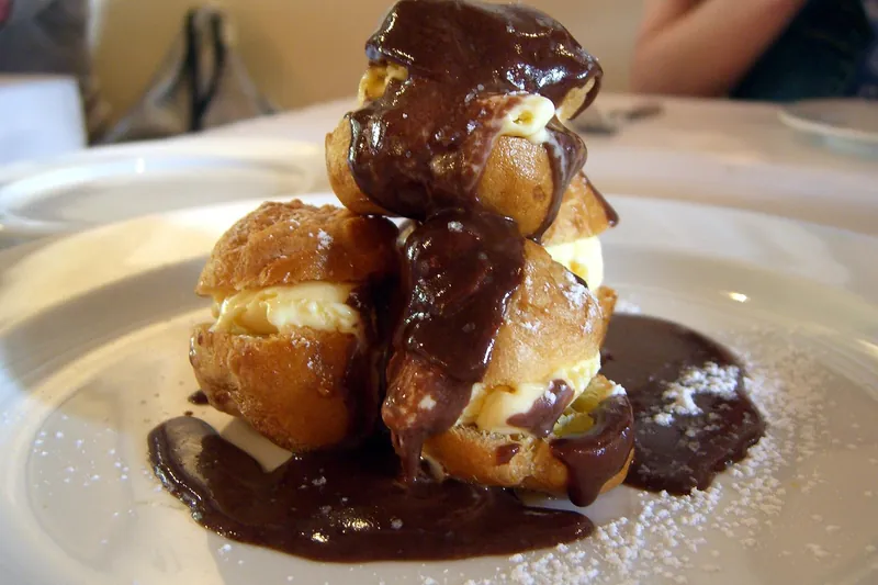 Profiteroles topped with chocolate sauce